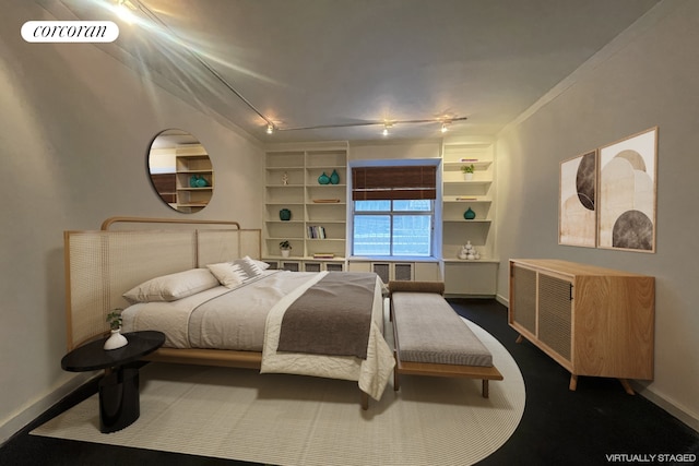 bedroom featuring baseboards and visible vents