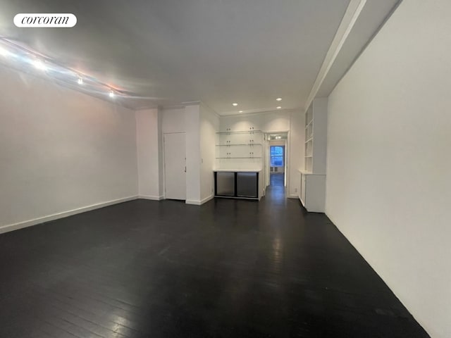 unfurnished living room with dark wood-style floors, recessed lighting, visible vents, and baseboards