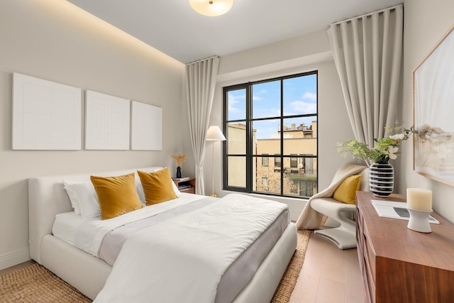 303 W 113th St Ph, Ph, New York City, NY 10026 - bedroom with light wood-style flooring