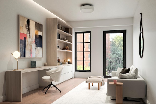 303 W 113th St Ph, Ph, New York City, NY 10026 - office with built in desk, light wood finished floors, and baseboards