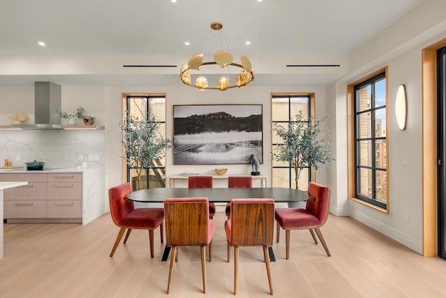 303 W 113th St Ph, Ph, New York City, NY 10026 - dining area with light wood-type flooring, recessed lighting, a chandelier, and baseboards