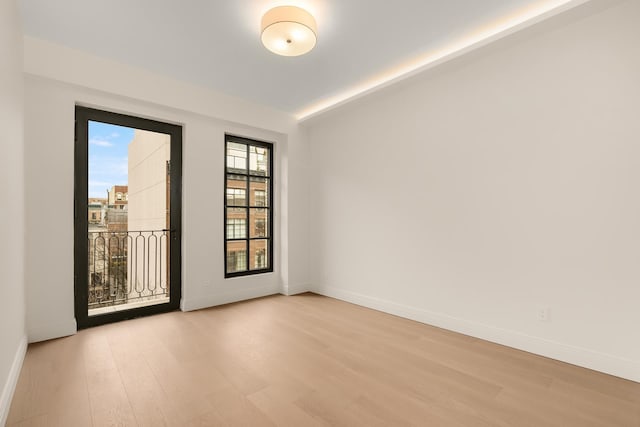 303 W 113th St Ph, Ph, New York City, NY 10026 - unfurnished room featuring light wood finished floors and baseboards