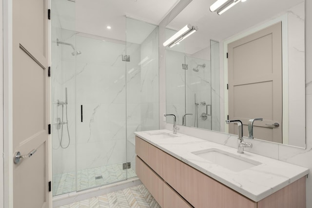 303 W 113th St Ph, Ph, New York City, NY 10026 - bathroom with a marble finish shower, double vanity, and recessed lighting