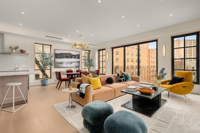 303 W 113th St Ph, Ph, New York City, NY 10026 - living room featuring light wood-style flooring, a chandelier, and recessed lighting