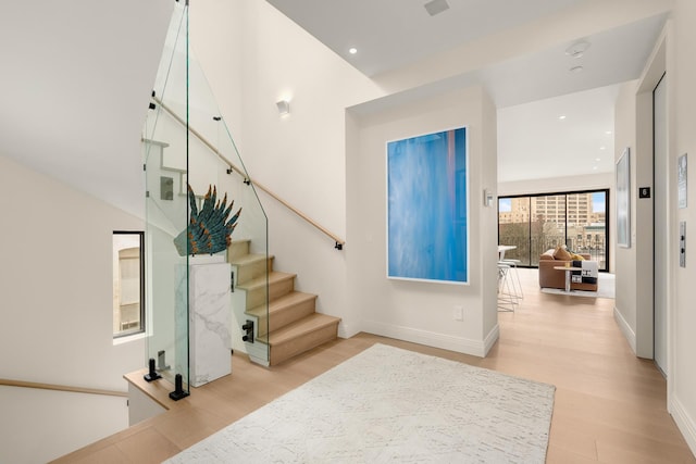303 W 113th St Ph, Ph, New York City, NY 10026 - entrance foyer featuring wood finished floors, stairway, recessed lighting, and baseboards