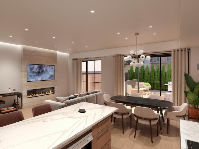 interior space featuring a chandelier, recessed lighting, and a fireplace