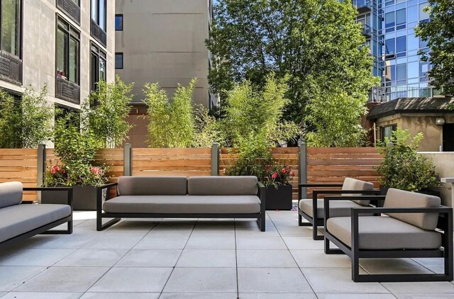 view of patio featuring a balcony and a city view