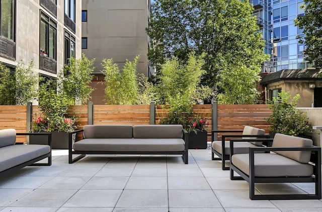 view of patio featuring fence and outdoor lounge area