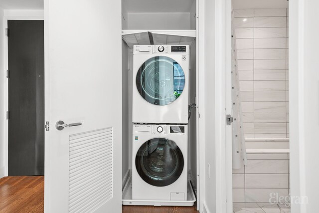 261 W 25th St Unit 1-C, New York City, NY 10001 - bathroom featuring vanity, marble finish floor, visible vents, tile walls, and tiled shower / bath