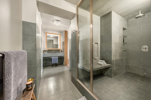 bathroom featuring a shower stall, vanity, and tile patterned floors