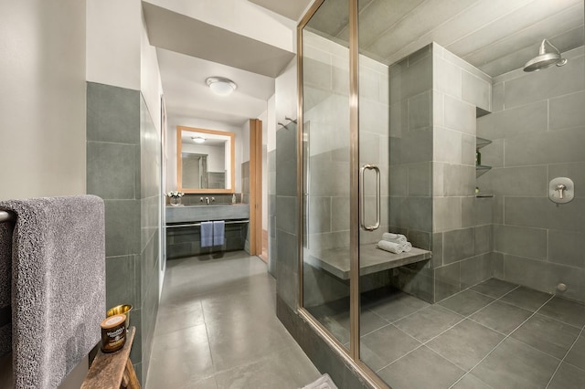 bathroom featuring a stall shower, vanity, and tile patterned flooring