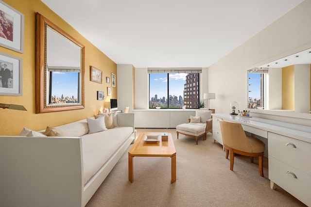 living area featuring an office area and light colored carpet