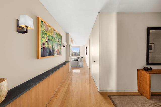 hallway with light wood-style floors