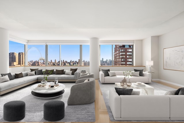 living room with baseboards, a city view, and wood finished floors