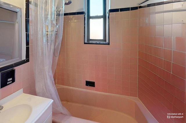 full bathroom featuring vanity and shower / bathtub combination with curtain