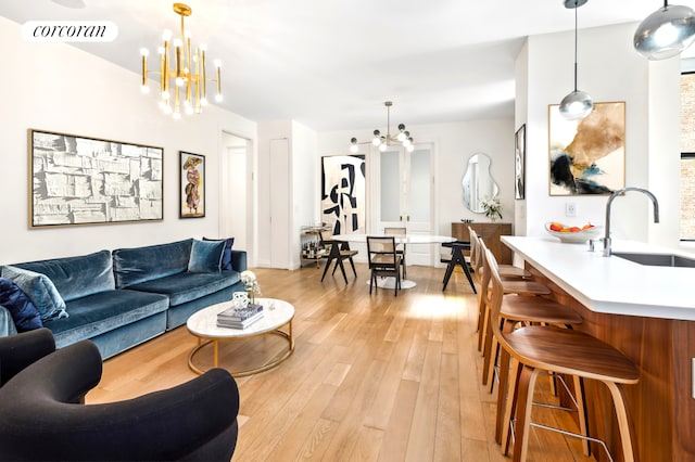 299 Riverside Dr Unit 3C, New York City, NY 10025 - living room featuring a chandelier and light wood-style flooring