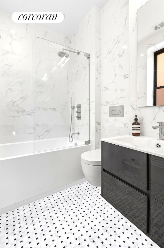 299 Riverside Dr Unit 3C, New York City, NY 10025 - full bath featuring toilet, a combined bath / shower with marble appearance, vanity, and tile walls