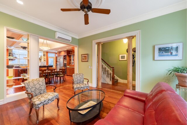 dining room featuring crown molding, wood finished floors, baseboards, and a raised ceiling