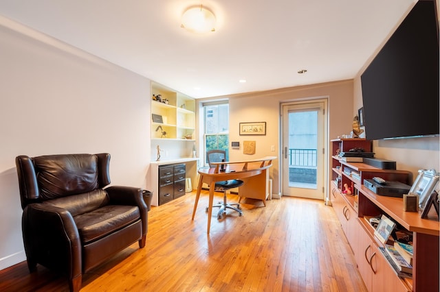 home office featuring light wood-style flooring