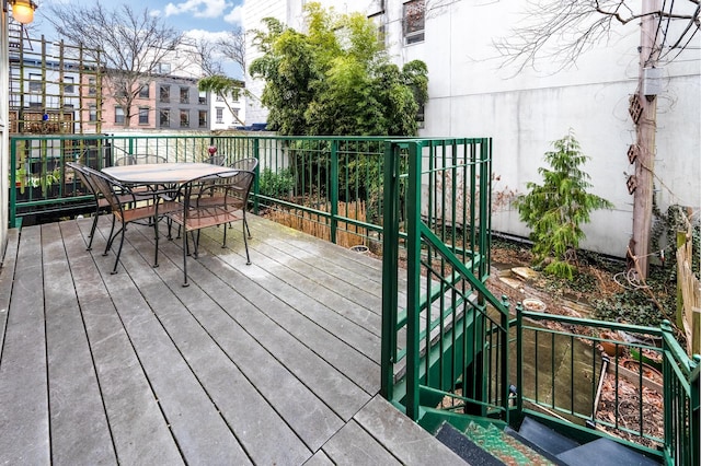 wooden deck with outdoor dining space