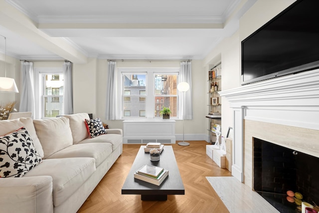 living area with crown molding, a high end fireplace, and a healthy amount of sunlight