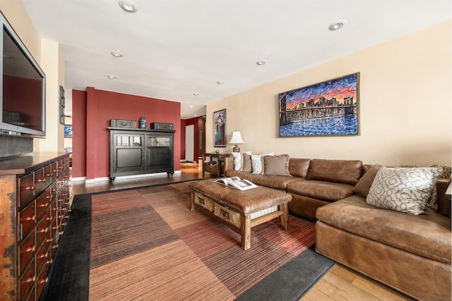 living room featuring wood finished floors and recessed lighting