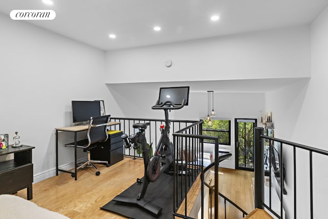 exercise area with recessed lighting, visible vents, baseboards, and wood finished floors