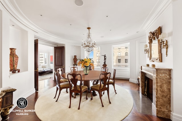 895 Park Ave Unit 16/17/18A, New York City, NY 10075 - dining room with baseboards, crown molding, a premium fireplace, and a notable chandelier