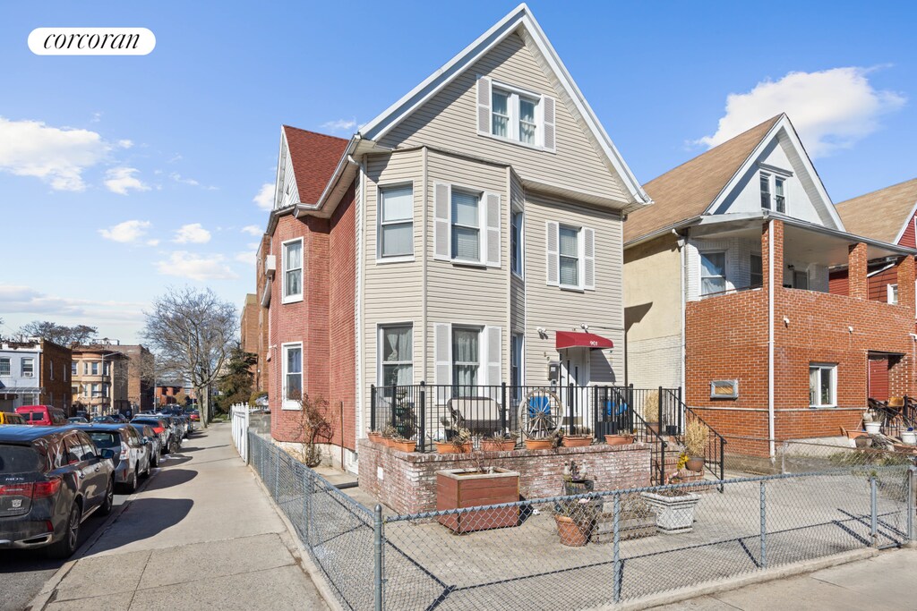 901 Newkirk Ave, New York City, NY 11230 - view of front of home featuring brick siding and a fenced front yard