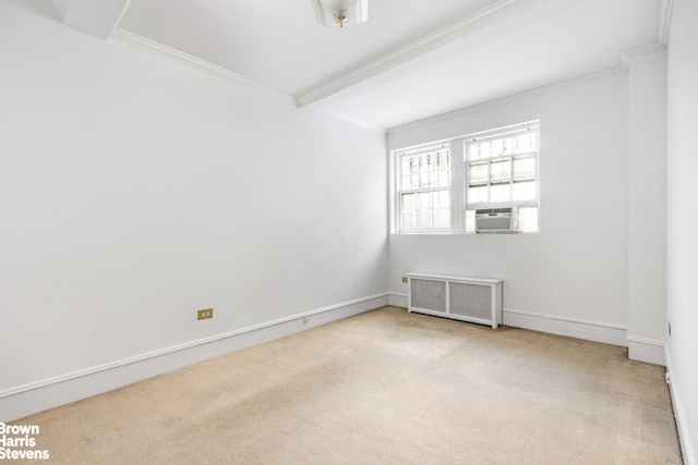 carpeted spare room featuring cooling unit, baseboards, crown molding, and radiator heating unit