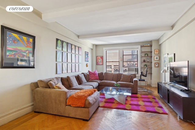 living area with beamed ceiling, visible vents, and baseboards