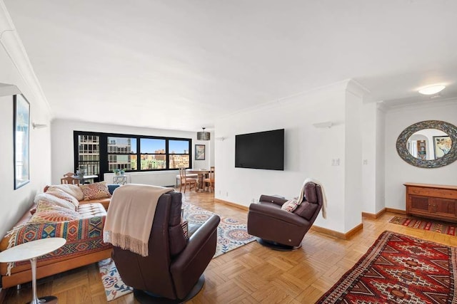 living room featuring baseboards and crown molding