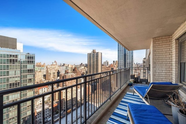 balcony featuring a city view