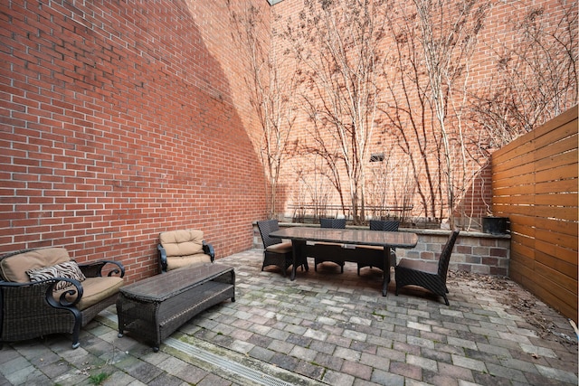 view of patio / terrace featuring outdoor dining area and fence private yard