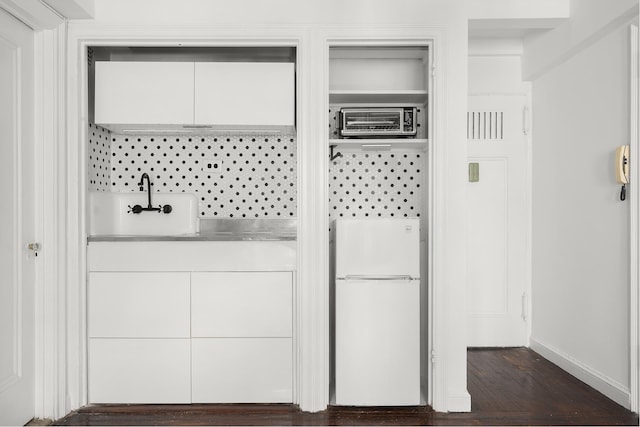 25 Tudor City Pl Unit 1316, New York City, NY 10017 - interior space featuring dark wood-style flooring, baseboards, and a sink