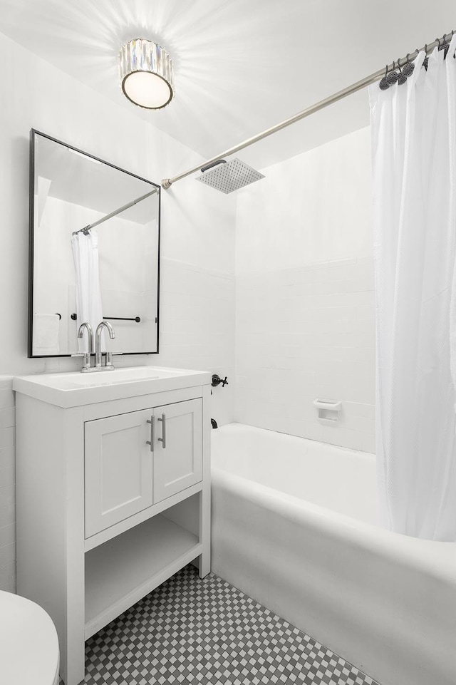 25 Tudor City Pl Unit 1316, New York City, NY 10017 - bathroom with vanity, shower / bath combo with shower curtain, and toilet