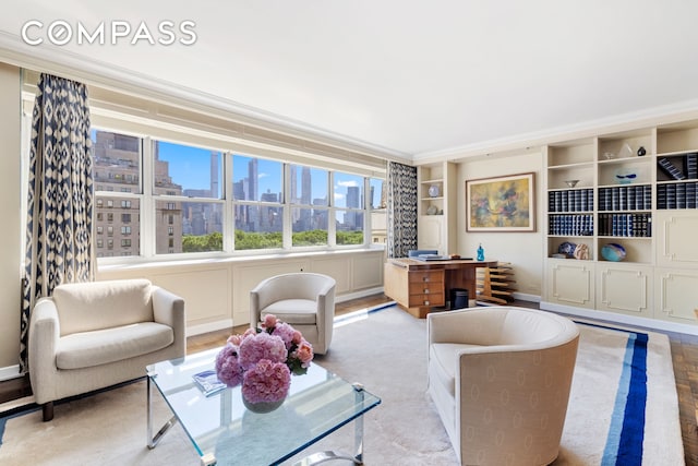 living room with a view of city and built in shelves