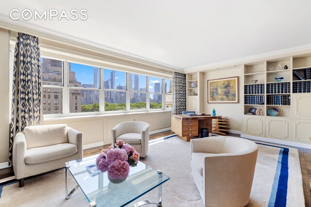 900 5th Ave Unit 14C, New York City, NY 10021 - living room with a skyline view and ornamental molding