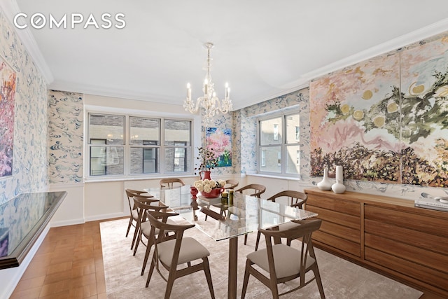 dining space with wallpapered walls, ornamental molding, and an inviting chandelier