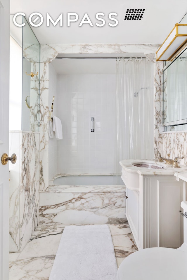 full bathroom with marble finish floor, visible vents, toilet, shower / bath combo with shower curtain, and vanity