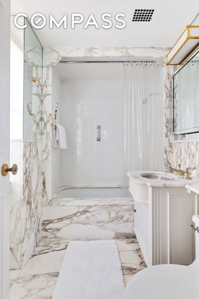 bathroom featuring vanity, tile walls, shower / bathtub combination with curtain, and visible vents