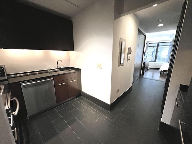 bar with stainless steel dishwasher, a sink, recessed lighting, and baseboards