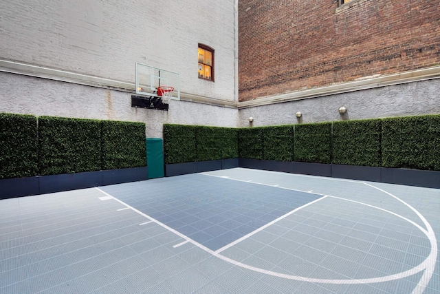 view of sport court featuring community basketball court and fence