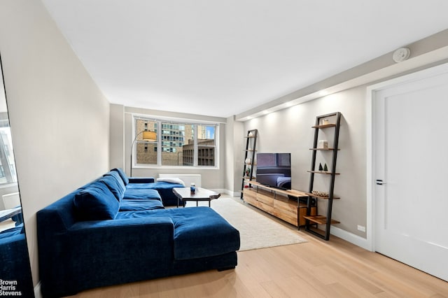 living room with light wood-style floors and baseboards