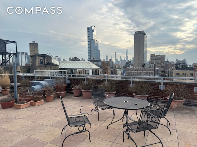 view of patio with a city view