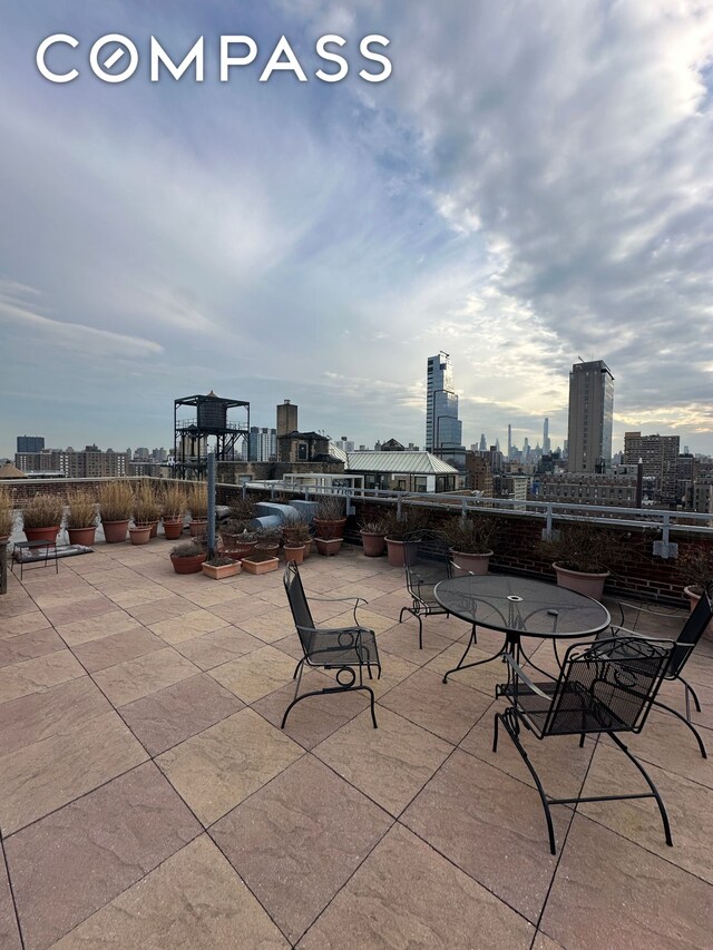 view of patio / terrace featuring a city view