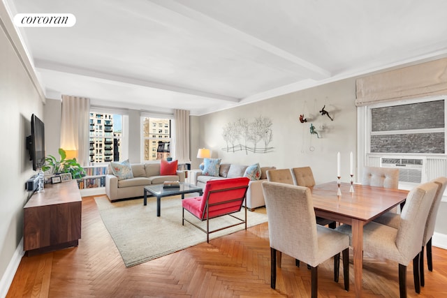 dining area featuring baseboards, cooling unit, visible vents, and beamed ceiling