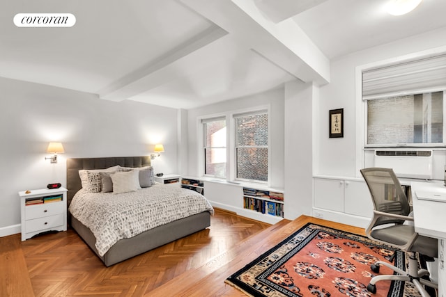 bedroom featuring baseboards, visible vents, and beamed ceiling