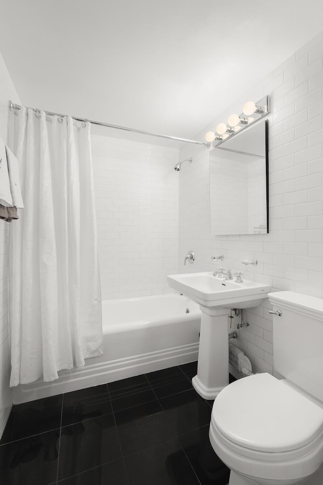 full bath with toilet, tile walls, shower / tub combo with curtain, and tile patterned flooring