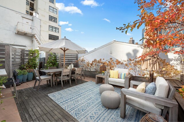 325 W 52nd St Phg, Phg, New York City, NY 10019 - exterior space featuring outdoor dining space, fence, and an outdoor hangout area